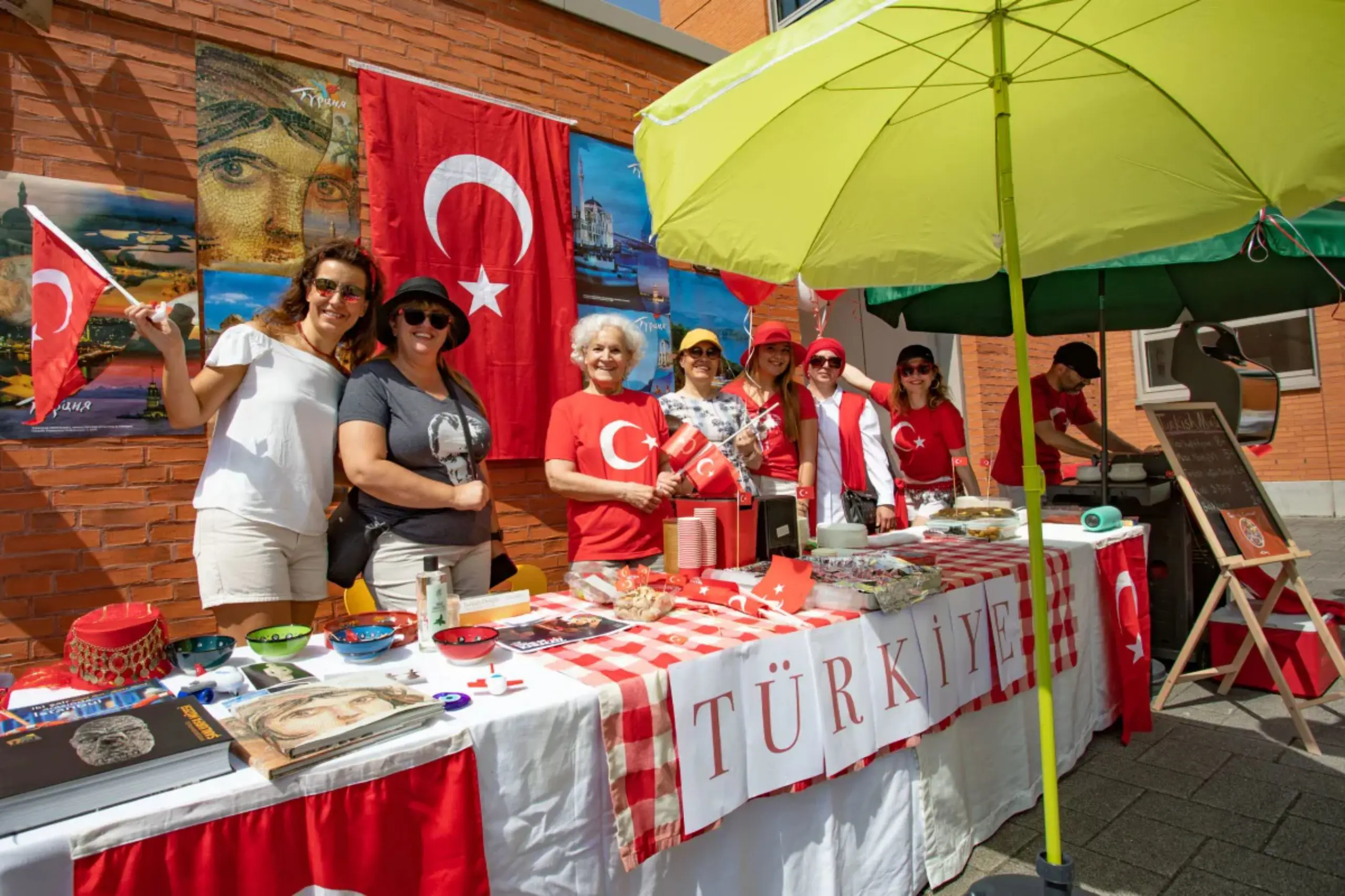 Volunteers hosted at a Turkish cultural food stall with traditional decorations during a school festival