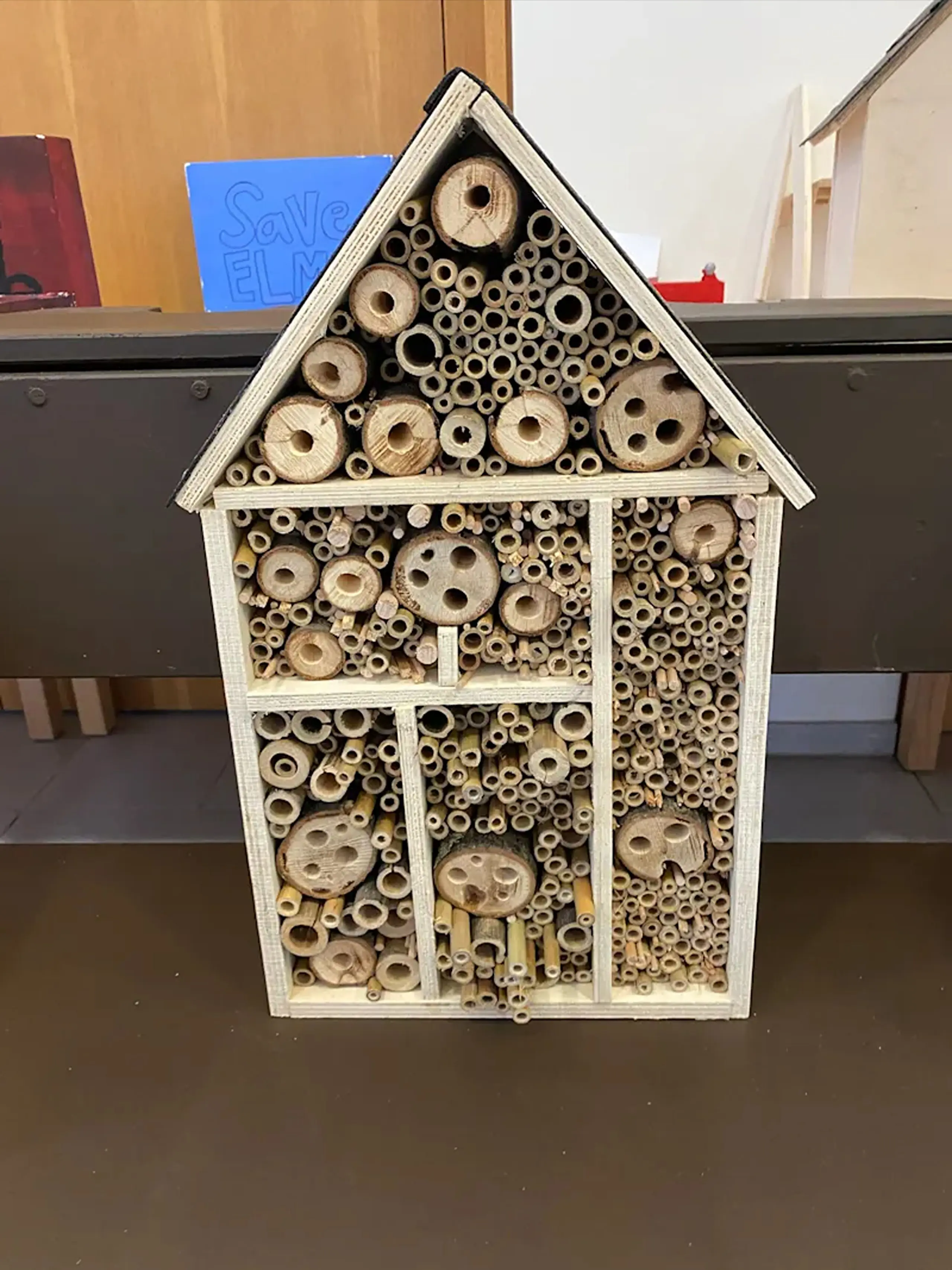 Wooden insect hotel designed for campus biodiversity and bug habitat