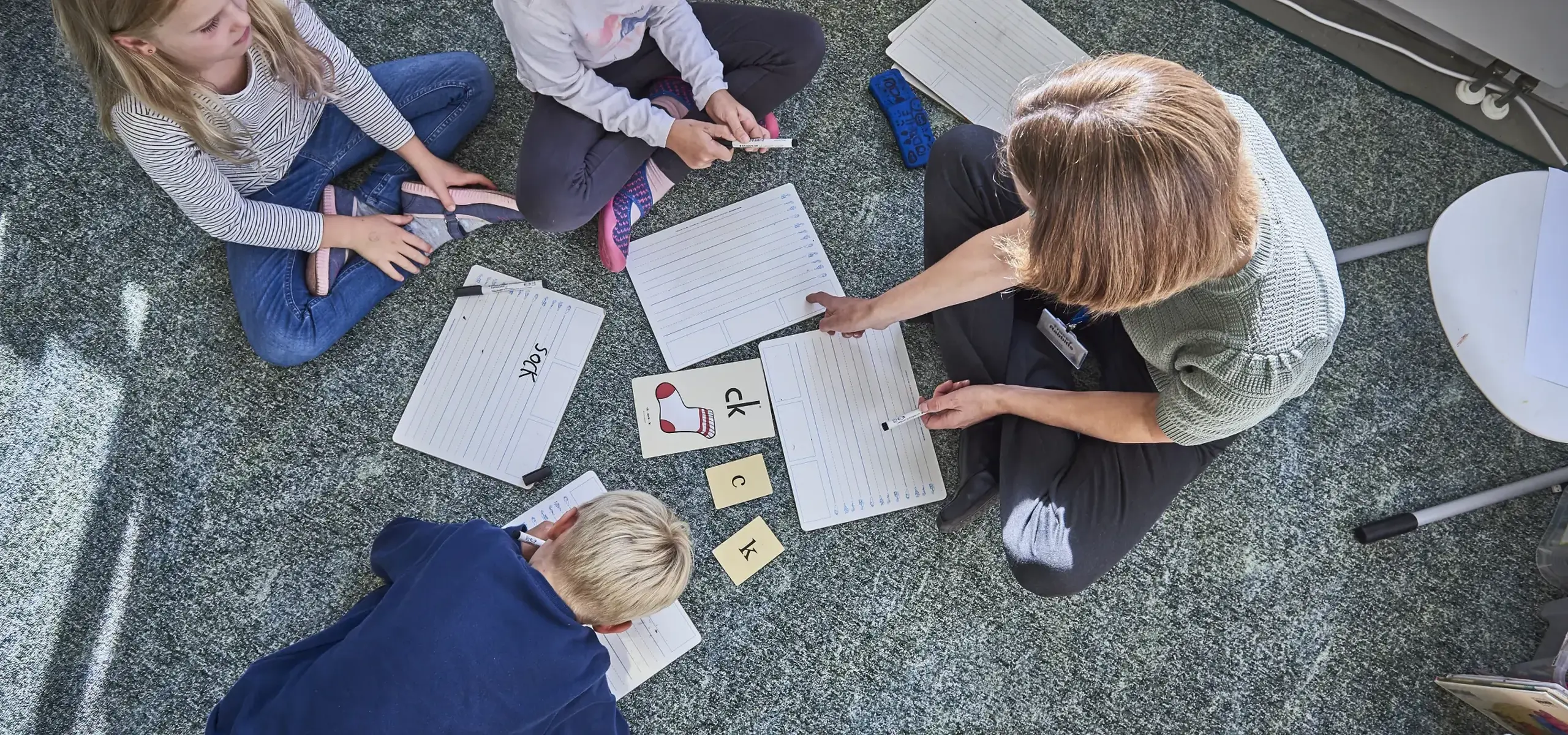 Students and teacher doing class activities