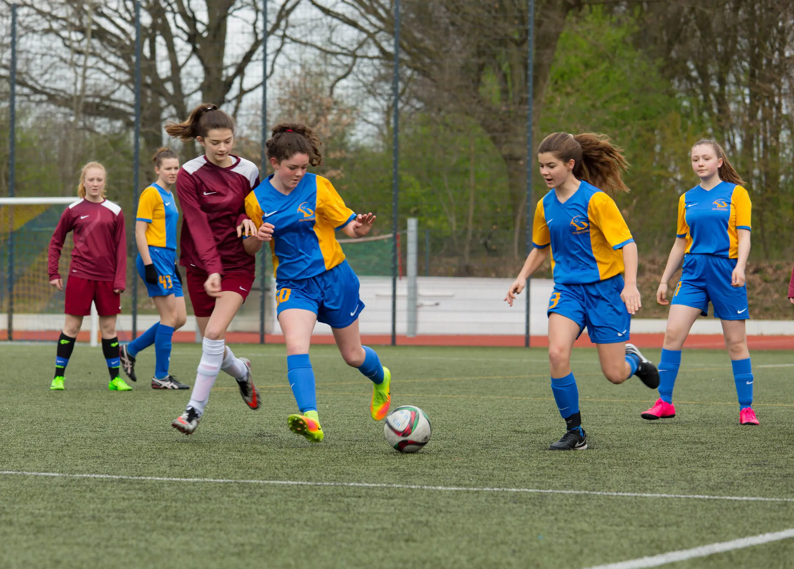 ISH students competing in a soccer match on the outdoor sports pitch