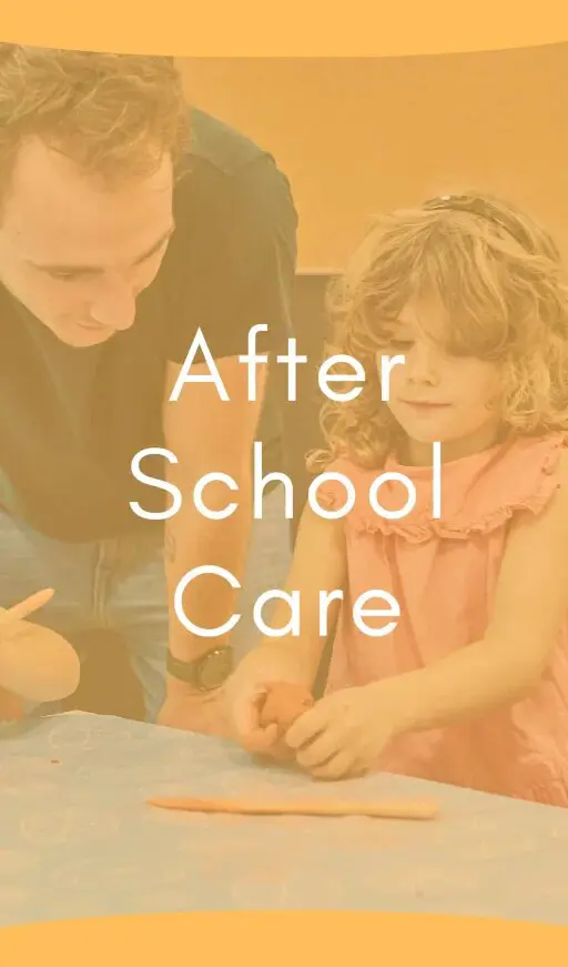 Teacher assisting a young student during after-school care activities